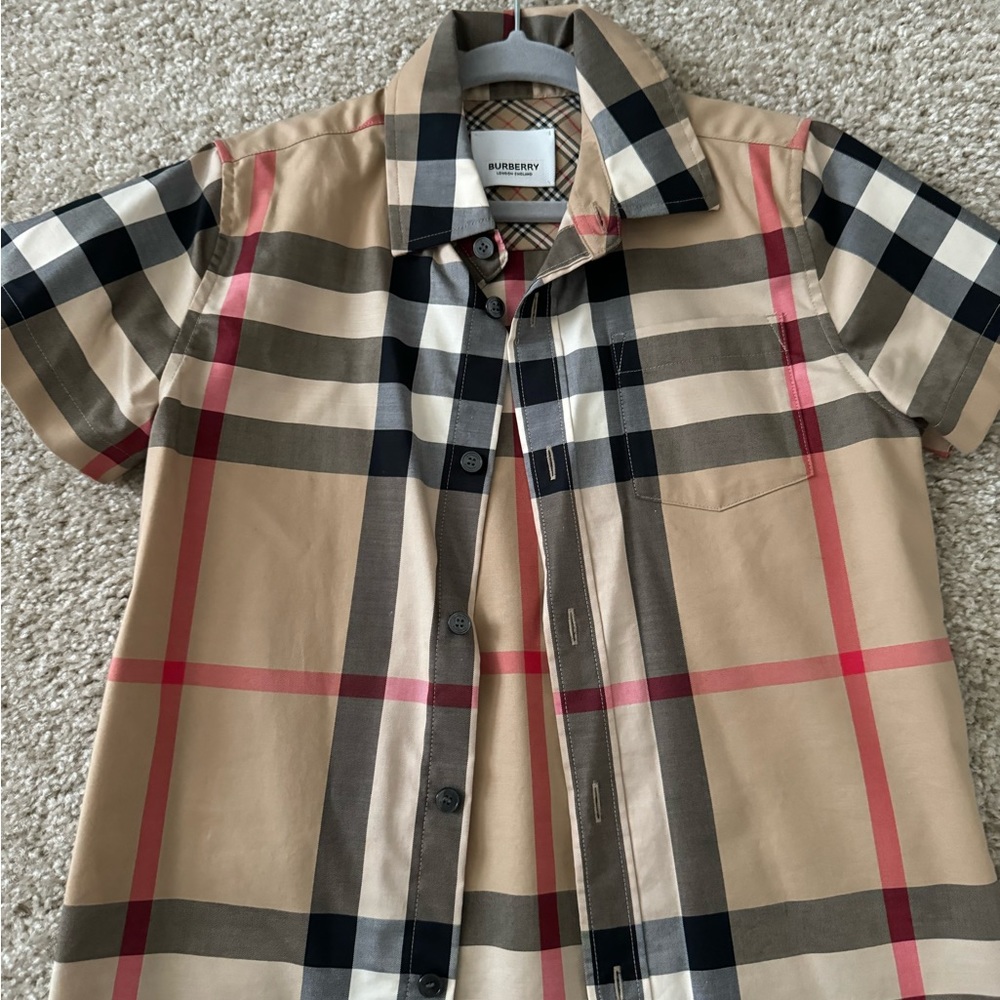 Authentic size 6 year-old Burberry shirts, my twins only worn these shirts once.